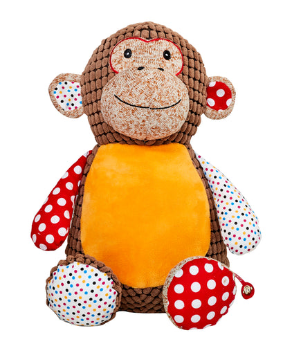 Brown patchwork Monkey Soft toy. He has one multicoloured polka dot ear, arm and foot, the other Ear, arm and foot is red with large polka dot. he has a brown corduroy body with an orange belly that can be personalised with any message using embroidery. He has small embroidered black eyes and a big cheeky smile