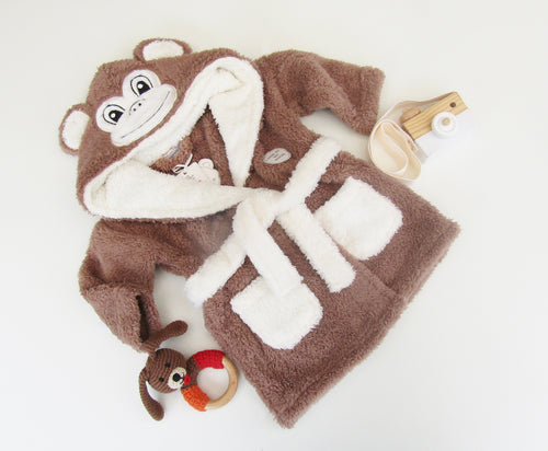 Novelty monkey dressing gown. brown chunky fleece with tie waiste. feature a monkey face and ears on hood.