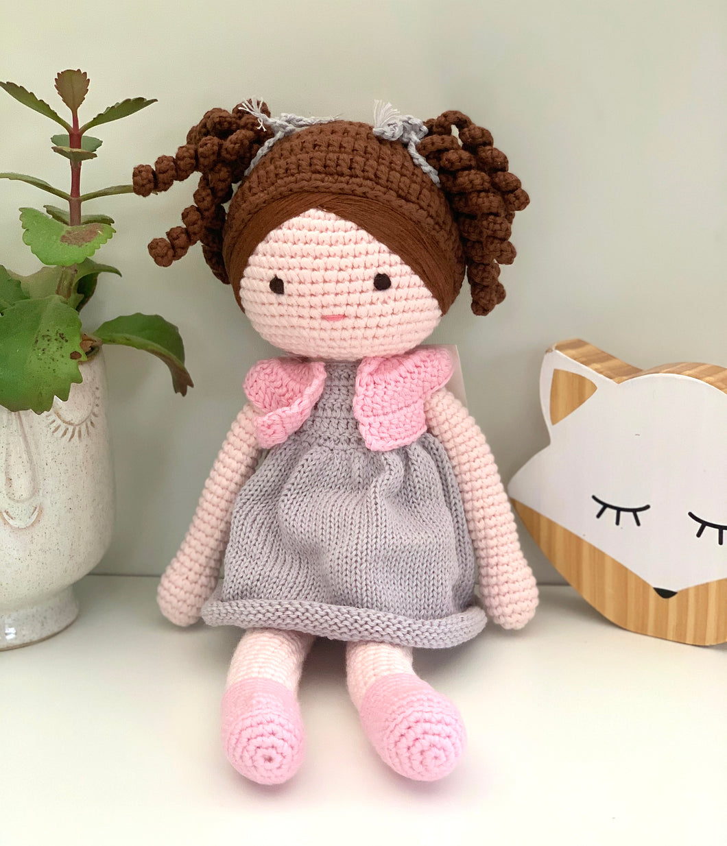 Hand crafted, hand made crochet doll, brown curly hair and grey dress. medium size 