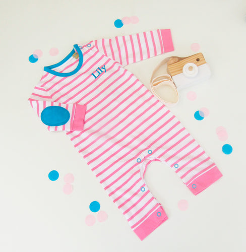 pink and white striped 100% cotton bodysuit all in one. long sleeves and constrasting blue elbow pads. Popper fastening around legs and shoulder.