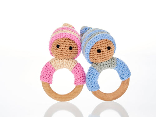 Blue & pink wooden & crochet teething ring rattles.  The wood ring is half wrapped with crocheted cotton with a cute head with stitched black eyes with a matching bobby hat.